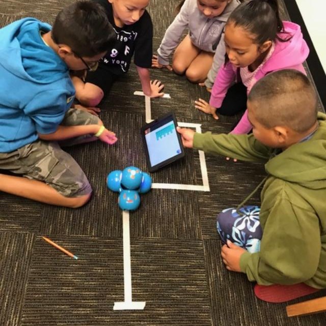 Scholars learn how to code robotics movements.