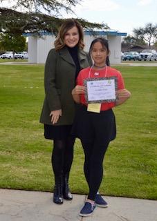 Principal Pinchot poses with our spelling bee champion.